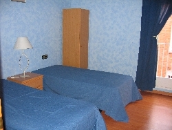 One of the twin rooms