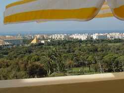 View on golf course, sea and village