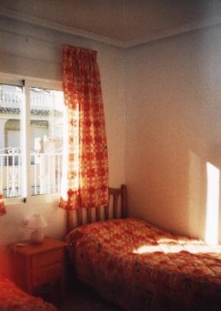The bedroom with twin beds
