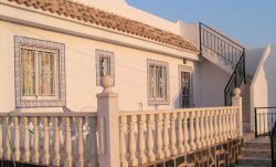 Rear terrace with steps to solarium