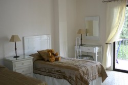 Sunny guest bedroom with twin beds